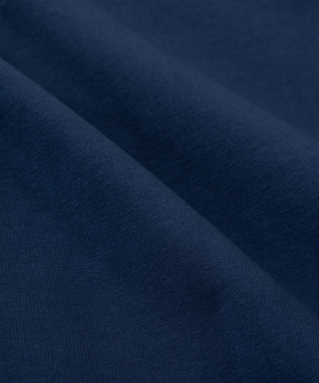 CUSTOM_ALT_TEXT: Fabric closeup on Paper Planes Chromatic Crewneck Sweatshirt color Naval Academy.