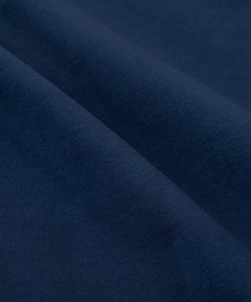 CUSTOM_ALT_TEXT: Fabric closeup on Paper Planes Chromatic Crewneck Sweatshirt color Naval Academy.