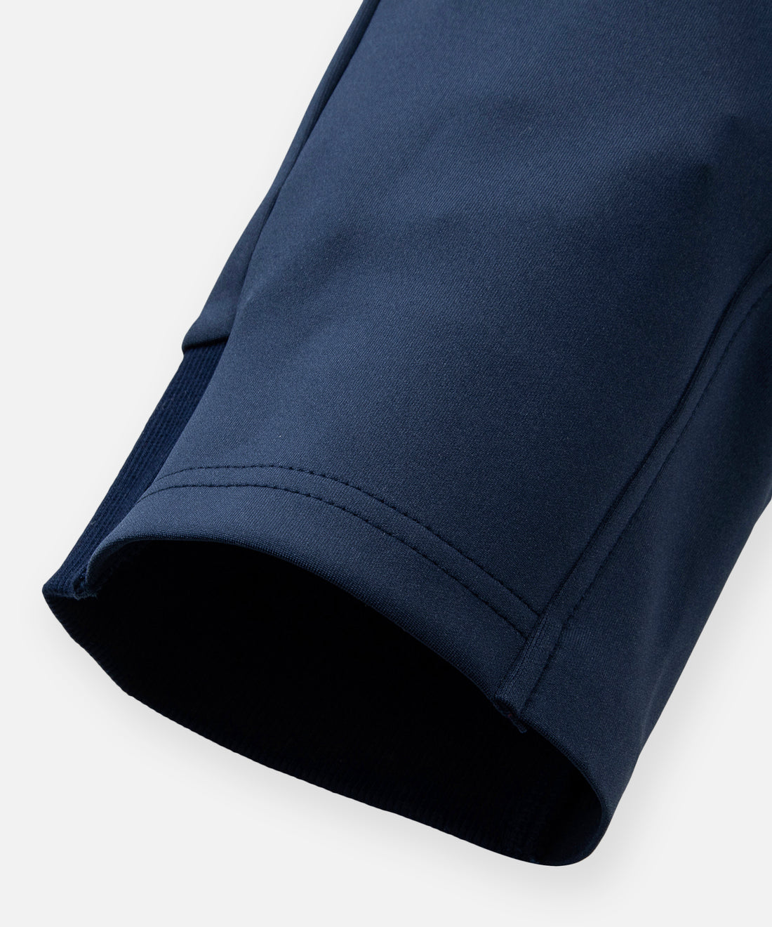 CUSTOM_ALT_TEXT: Hem detail on Paper Planes Slim Fit Chromatic Jogger color Naval Academy.