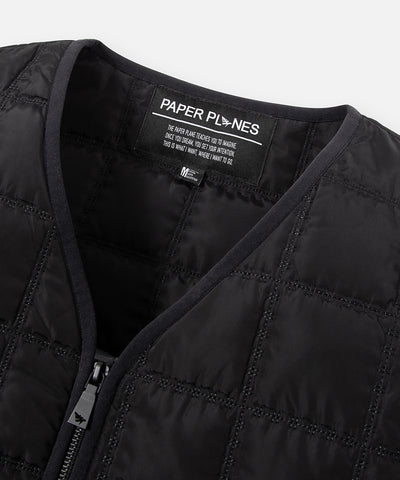 CUSTOM_ALT_TEXT: Binded neckline detail on Paper Planes All-Purpose Quilted Vest, color Black.