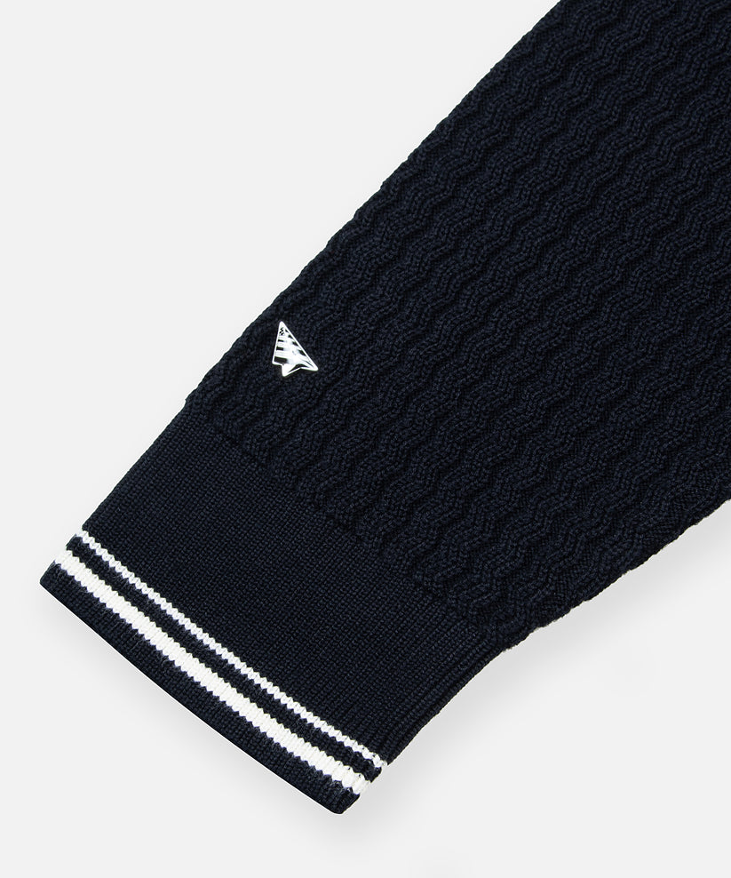 CUSTOM_ALT_TEXT: Paper Plane enameled metal rivet on Paper Planes Racked Rib Sweater, color Parisian Night.