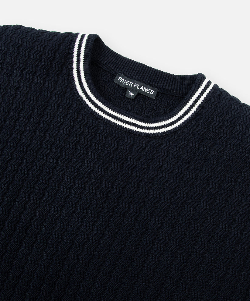 CUSTOM_ALT_TEXT: Rib neck with contrast yarn dye stripes on Paper Planes Racked Rib Sweater, color Parisian Night.