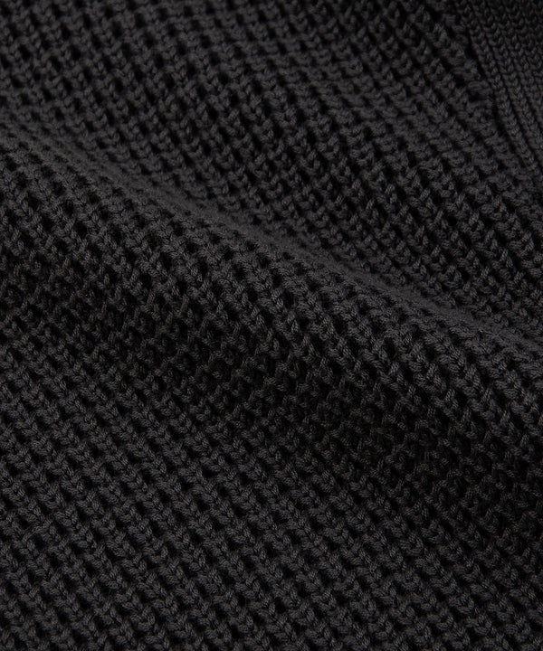 CUSTOM_ALT_TEXT: Closeup of waffle stitch on Paper Planes Sweater Knit Jogger, color Pirate Black.