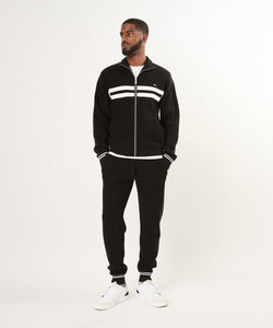 CUSTOM_ALT_TEXT: Male model wearing Paper Planes Sweater Track Jacket and Jogger, color Black.