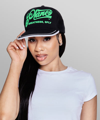 CUSTOM_ALT_TEXT: Female model wearing Planes Greatness Trucker Hat color Black.