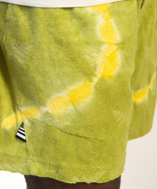 CUSTOM_ALT_TEXT: Closeup of Paper Planes Do or Dye Terry Cloth Short color Olive.