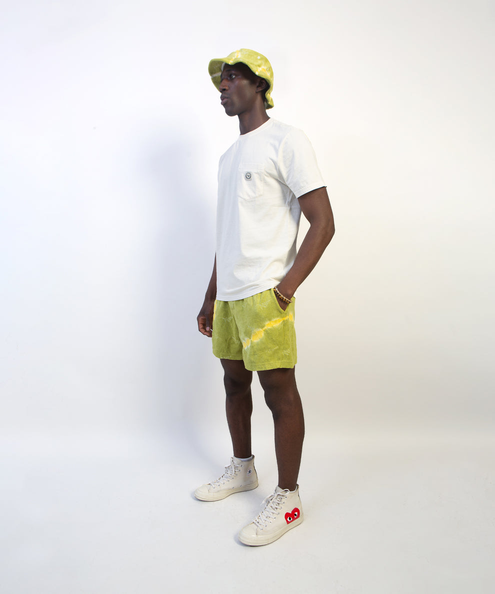 CUSTOM_ALT_TEXT: Male model wearing Paper Planes Do or Dye Terry Cloth Short color Olive.