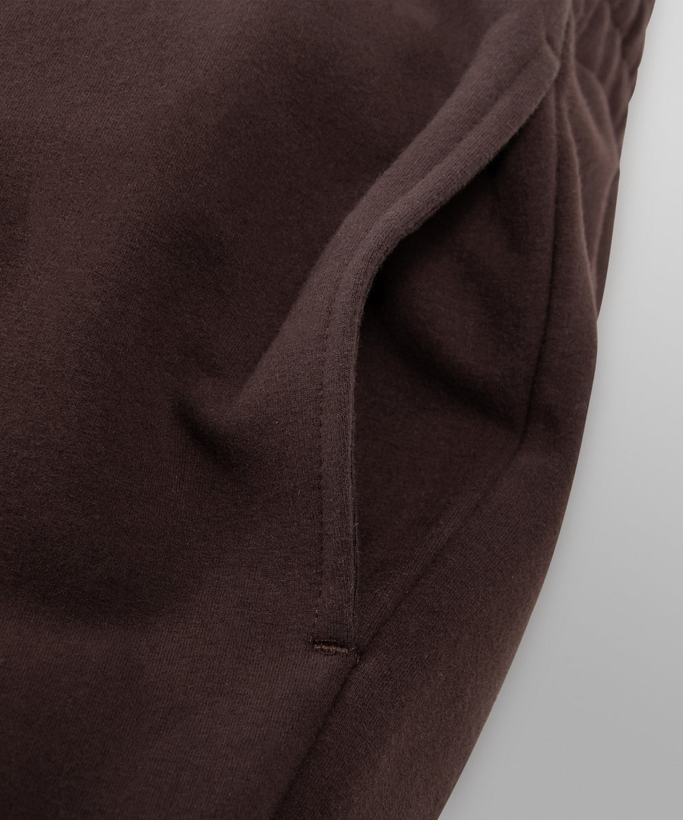 CUSTOM_ALT_TEXT:On-seam pocket on Paper Planes Women’s Brushed Surface Fleece Sweatpant color Coffee.