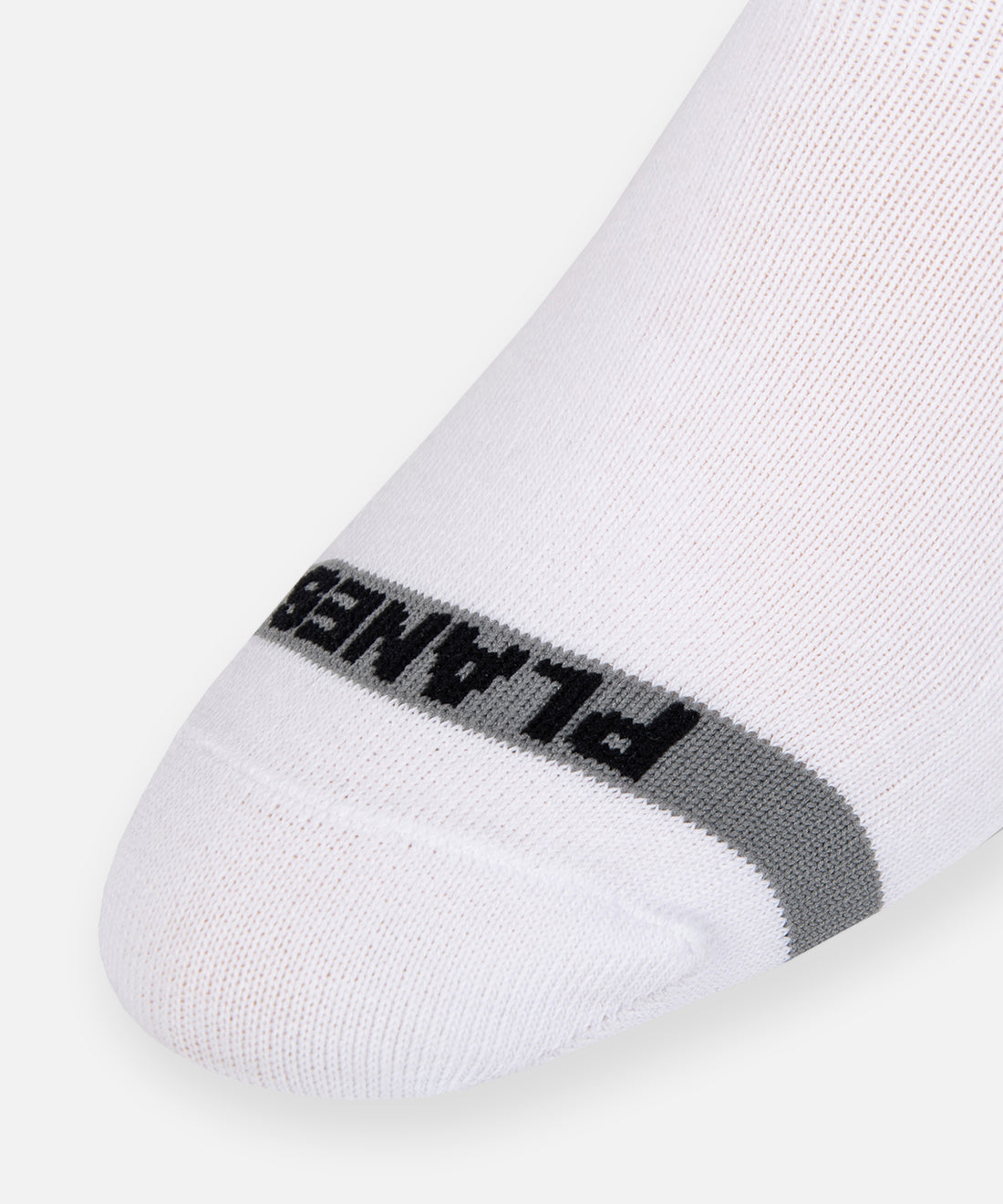 CUSTOM_ALT_TEXT: Planes logo jacquard on Paper Planes  No Show Socks color White.