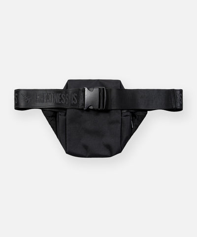 CUSTOM_ALT_TEXT: Back view of Paper Planes Quilted Sling Bag with GREATNESS IS A PROCESS tonal jacquard webbing strap and buckle.