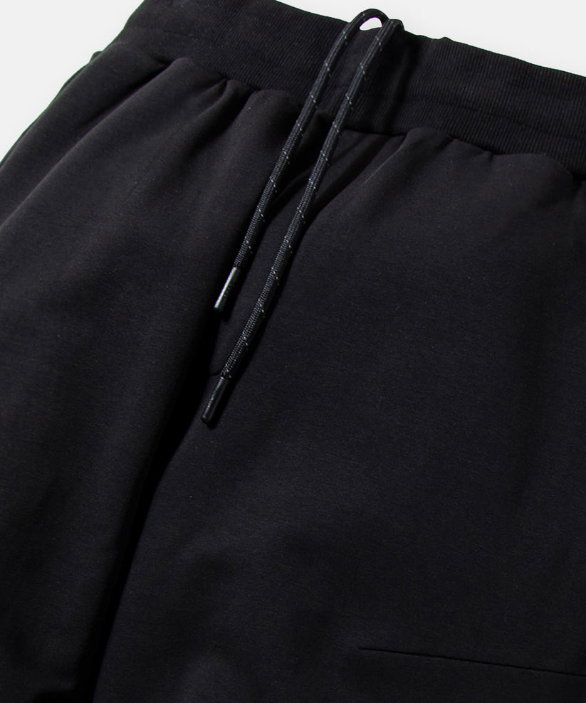 CUSTOM_ALT_TEXT: Encased elastic waistband with interior exit drawcord on Paper Planes Solid Jogger, color Black.