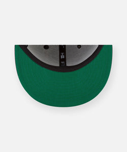 CUSTOM_ALT_TEXT: Green undervisor on Paper Planes The Original Crown 9Fifty Snapback Hat.